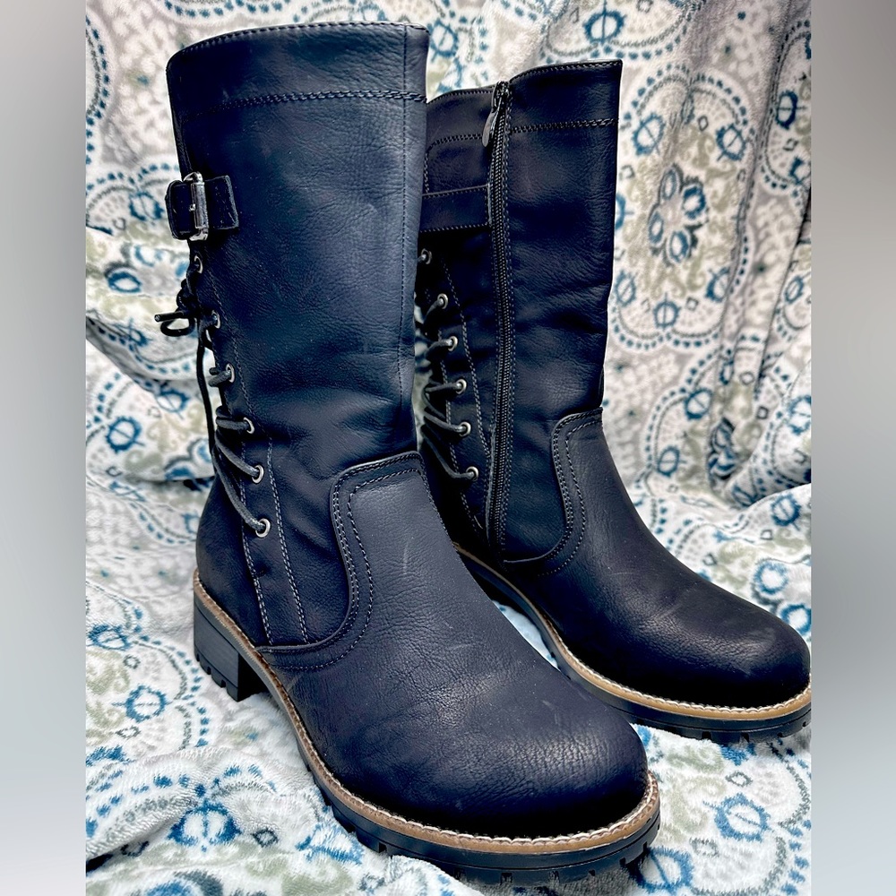 Woman’s size 9 calf boots that lace up in the back.
